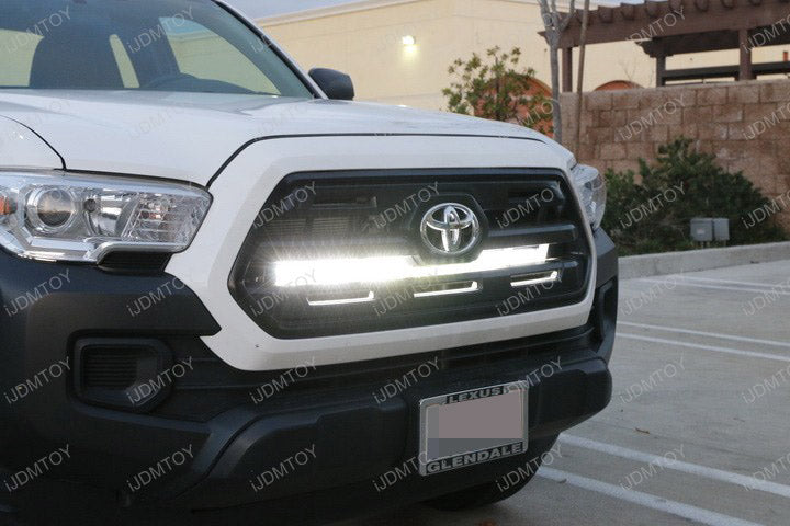 LED Light Bar Sits Subtly Behind a Toyota Tacoma Grille